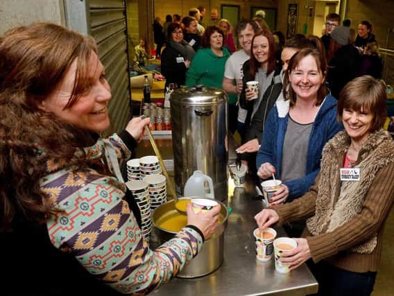 Fundraising manager from The Brick - Janet Mitchell - serving soup to the participants