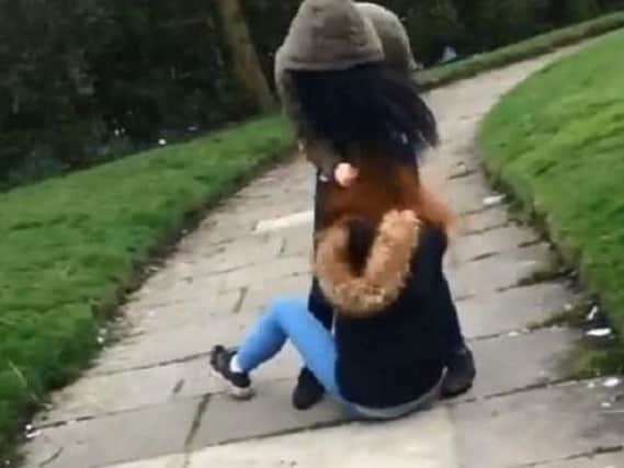 This image taken from one of the videos shows the victim being punched whilst on the floor