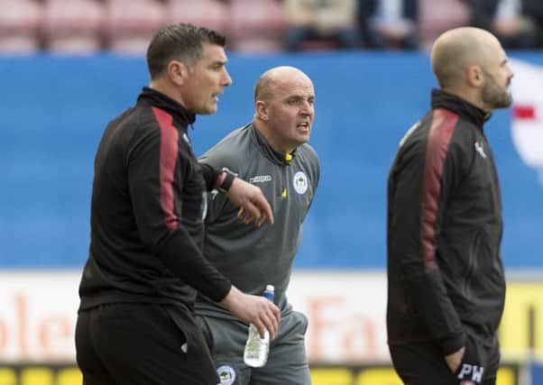 Managers watch from the sidelines at the DW on Saturday