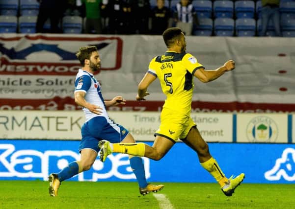 Will Grigg slots home what could prove to be a vital winner against Oxford