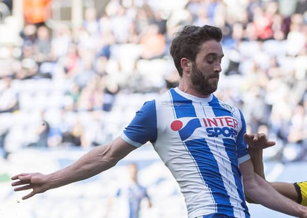 Will Grigg is one of the four Latics players included