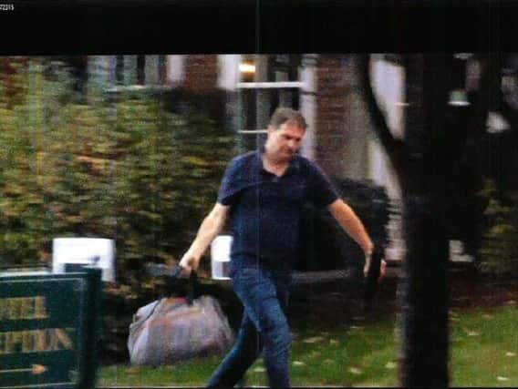 Surveillance footage of Federic Fagnoul carrying heavy bags from the helicopter to a room at the Chilston Park Hotel in Maidstone, Kent