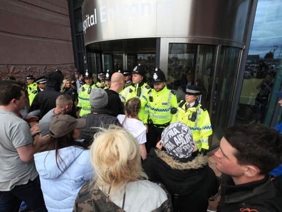 Police block protesters from the entrance to Alder Hey Children's Hospital