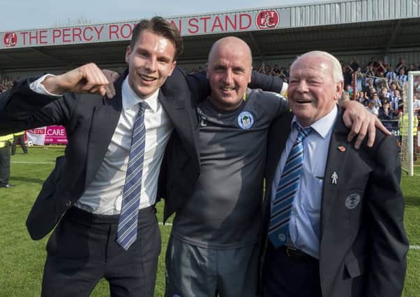 Paul Cook with chairman David Sharpe and club owner Dave Whelan