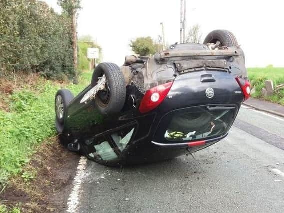 The car on its roof on Ashton Road