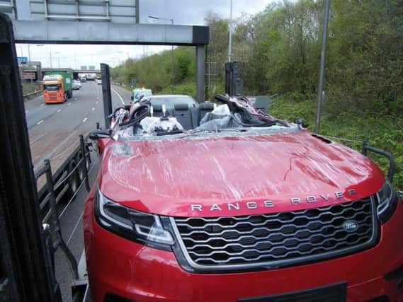 Car transporter crashes into bridge on M61 motorway