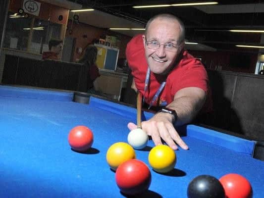 Anyone for pool? One of the team members at Wigan Youth Zone