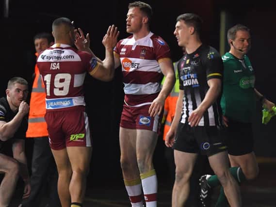Joe Burgess is congratulated on his try against Widnes