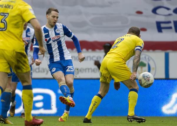 Nick Powell struggles to find a breakthrough against Wimbledon