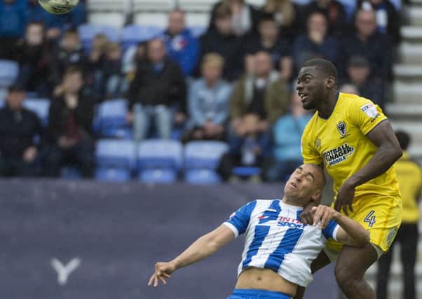 James Vaughan was denied a penalty for this challenge during the 1-1 draw with Wimbledon