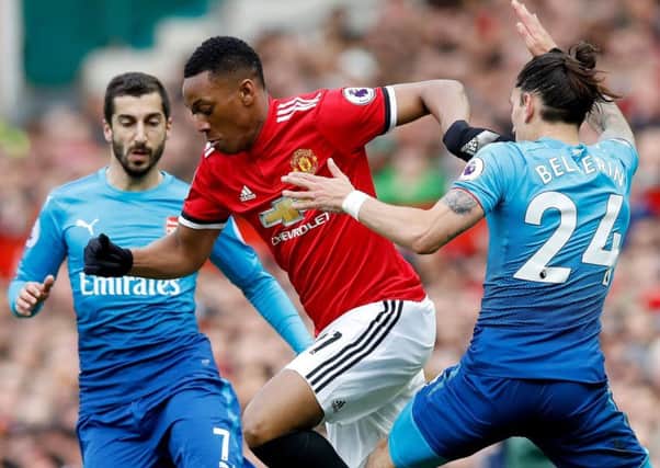 United forward Anthony Martial (centre)