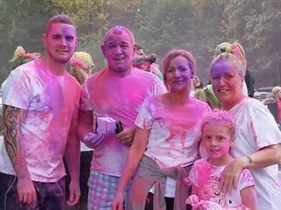 Neil Rigby (second from left) with his family at the colour run