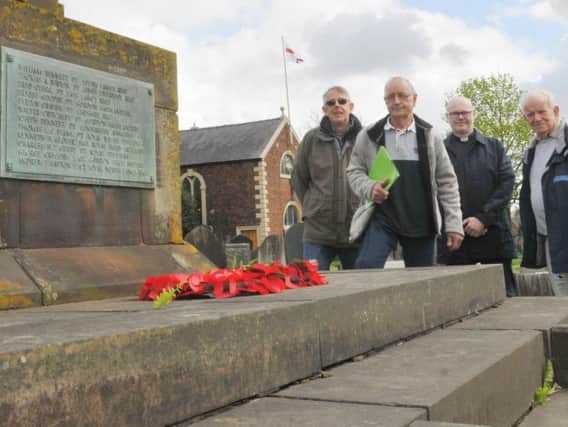 Members of the fabric committee at the war memorial from left, Grant Barr, Geoff Maines, Rev Jonathan Stott and Alan Baldwin and, below, Rev Stott in the grounds of Lowton St Lukes Church