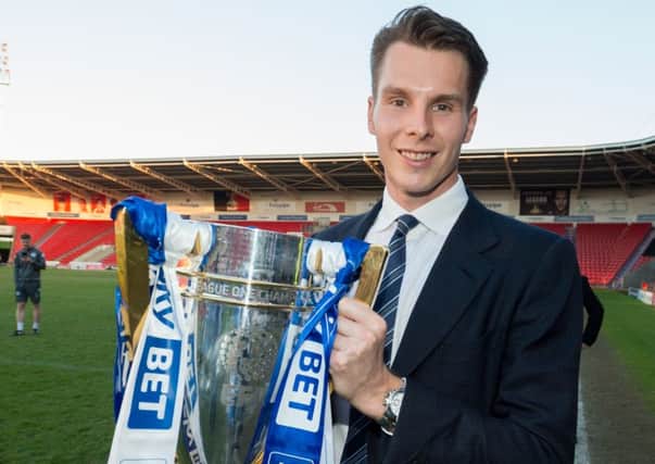 David Sharpe with the League One title