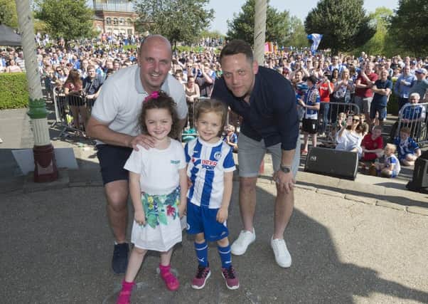Latics manager Paul Cook and assistant manager Leam Richardson with their children at the party in the park