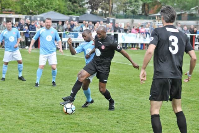 Emmerson Boyce strutting his stuff watched by Paul Scharner