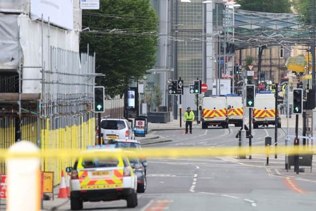 Police close to the Manchester Arena the morning after a terrorist attack at the end of a concert by US star Ariana Grande last May