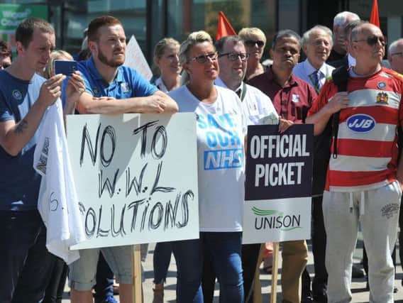 Hundreds of hospital staff strike, as Unison hold a rally against proposals to move some NHS staff at Wigan, Wrightington and Leigh hospitals to subsidiary firm WWL Solutions, held at Believe Square, Wigan