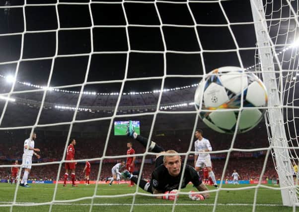 Liverpool goalkeeper Loris Karius looks on as he fails to stop Gareth Bale's spectacular overhead kick