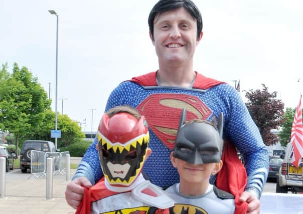 Is it a bird, is it a plane? No it's a dad and his two kids at Wigan Comic-Con!