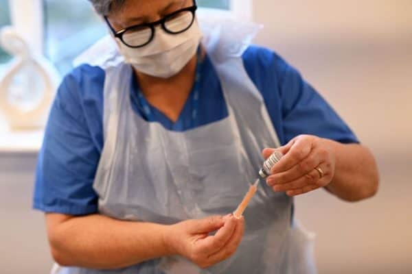 'One ought to also remember that Covid causes blood clots,' said one expert, 'so the risks of not having the vaccination far outweigh the risks from the vaccinations' (Photo: OLI SCARFF/AFP via Getty Images)